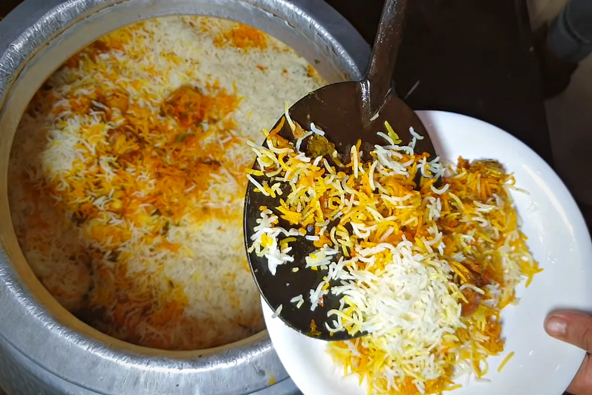 Raseeli beef biryani being served from the deg at Asad Pakwan Center, Karachi