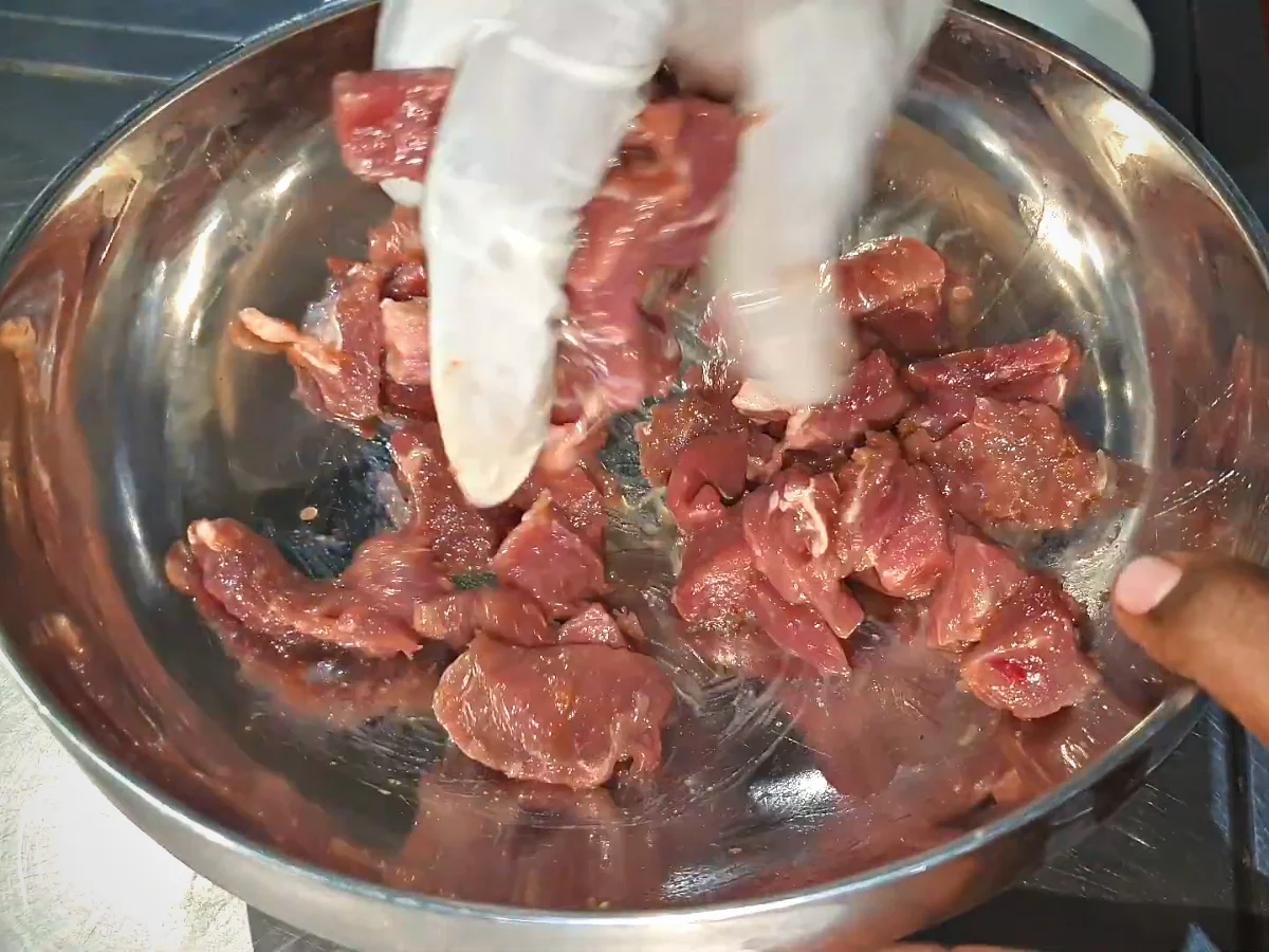 Thin slices of beef undercut in a bowl for beef chilli dry