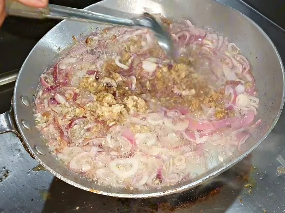 Onion cooking with ginger garlic paste for bihari boti