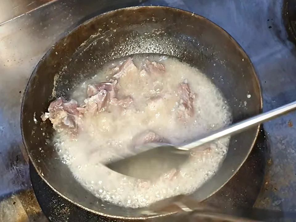 Tender boiled mutton chops with the water almost dried in the karahi