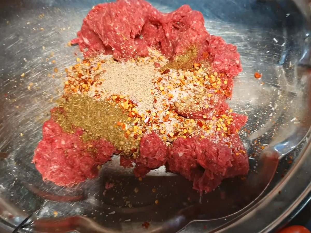 Spices added over beef mince for chapli kabab