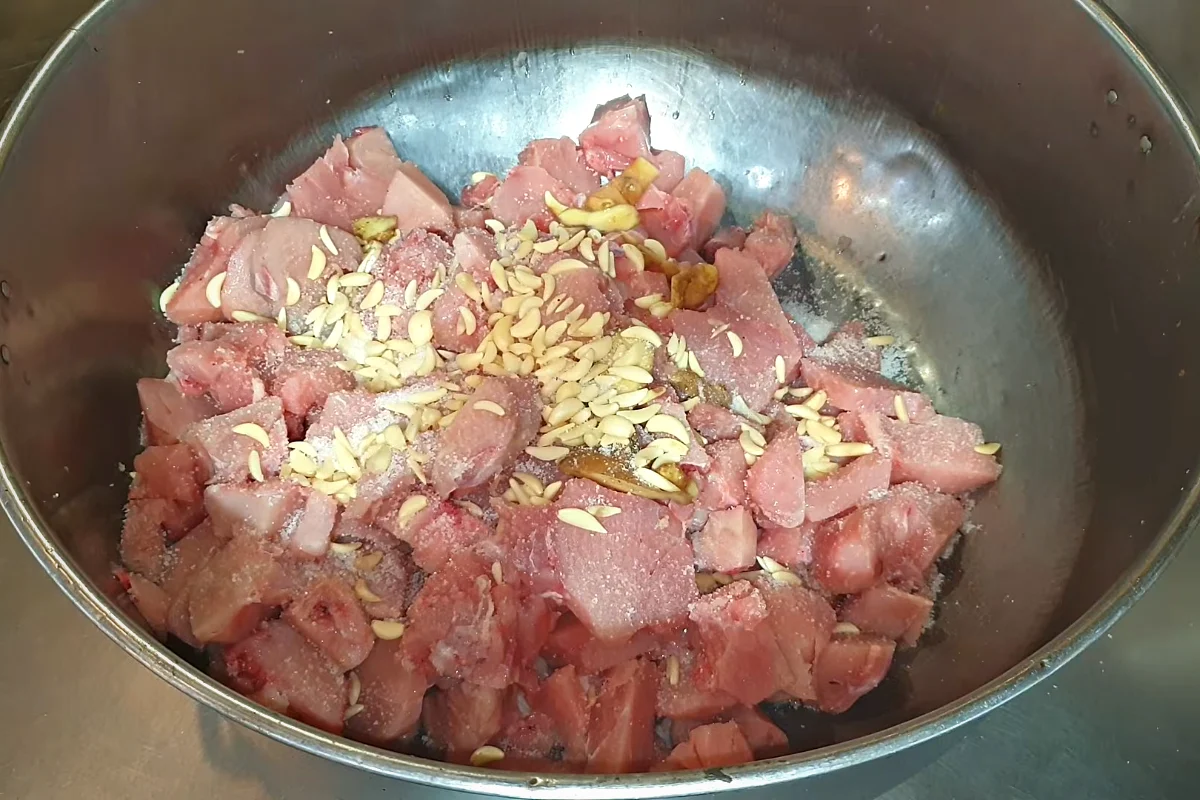 Chopped garlic and ginger over chicken cubes for reshmi kabab