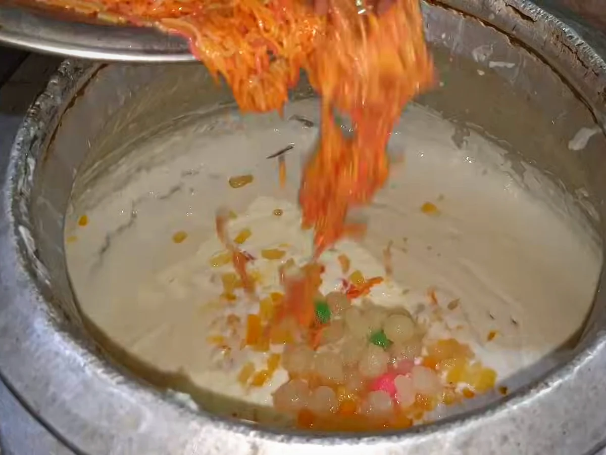 Colourful vermicelli being added to doodh dulari