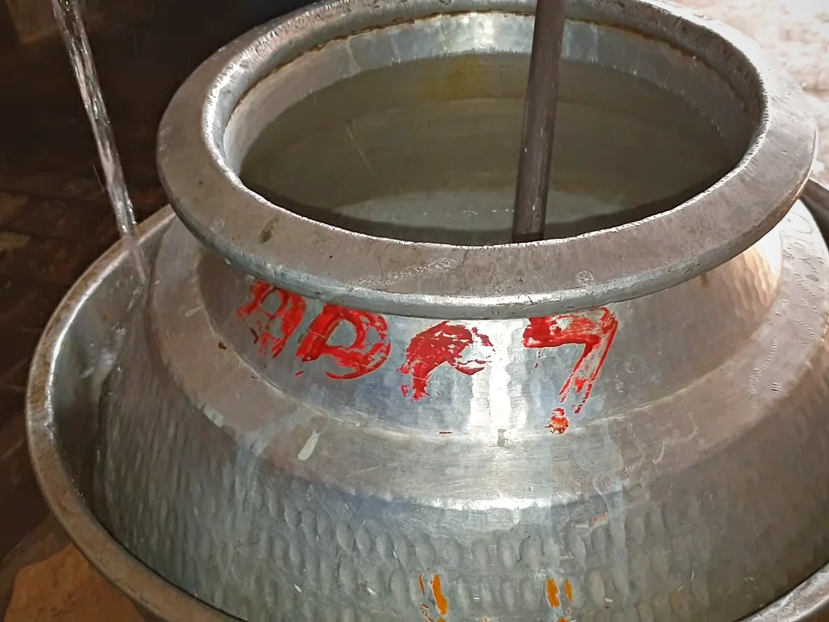 Pot of doodh dulari cooling in a tub of water
