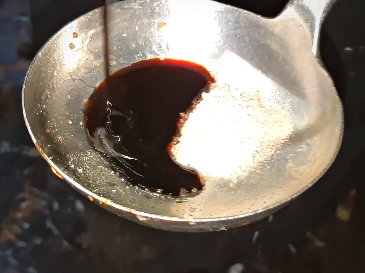 Dark soy sauce in a bowl for the beef chilli dry sauce