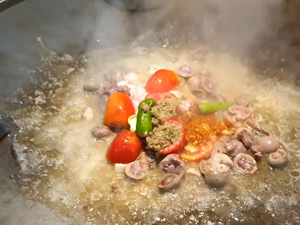 Green chillies, red chilli powder and ginger garlic paste on kata kat