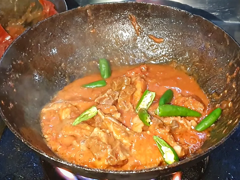 Whole green chillies added to mutton chops karahi