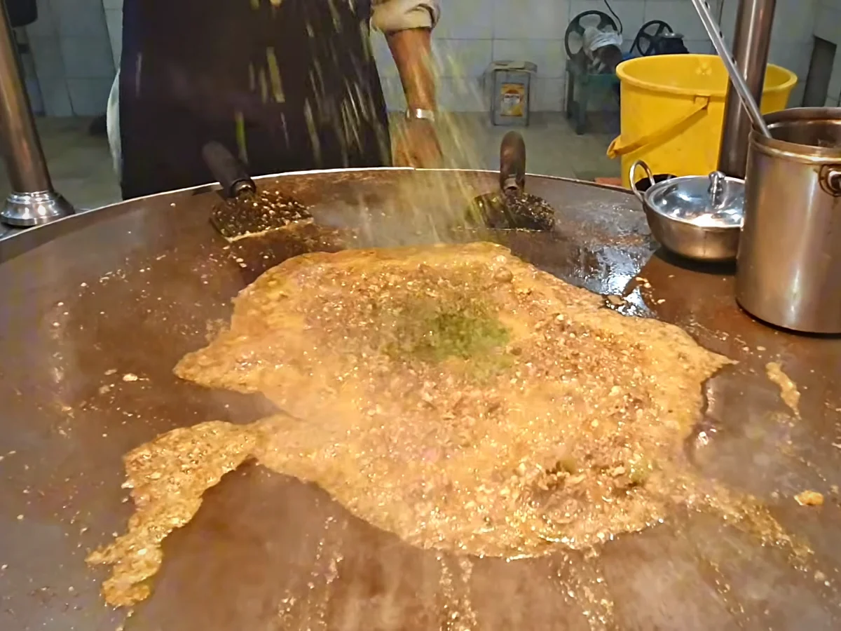 Kata kat masala with garam masala, cumin, coriander and kasuri methi on the tawa
