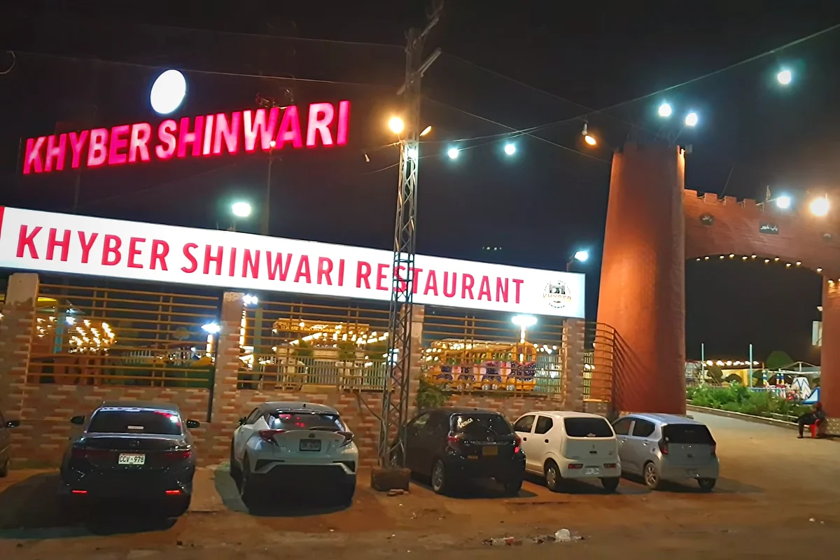 Khyber Shinwari Restaurant sign lit up at night