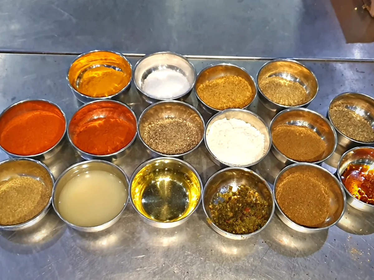 Bowls of spices laid out for Dua mutton chops marinade