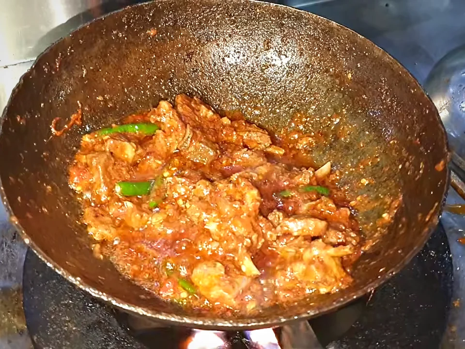 Mutton chops karahi cooked down to a thick masala with green chillies
