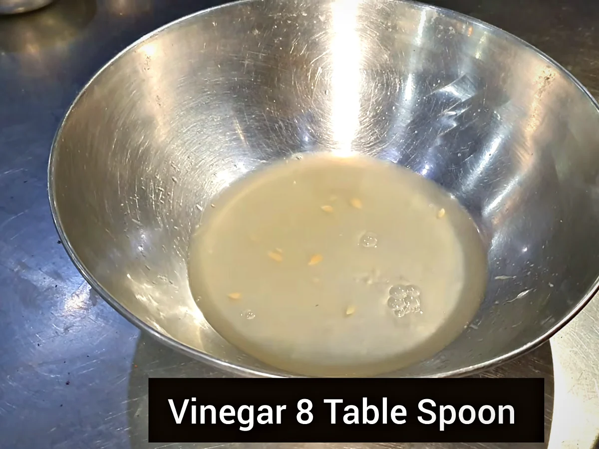 Vinegar and lemon juice in a bowl for mutton chops marinade