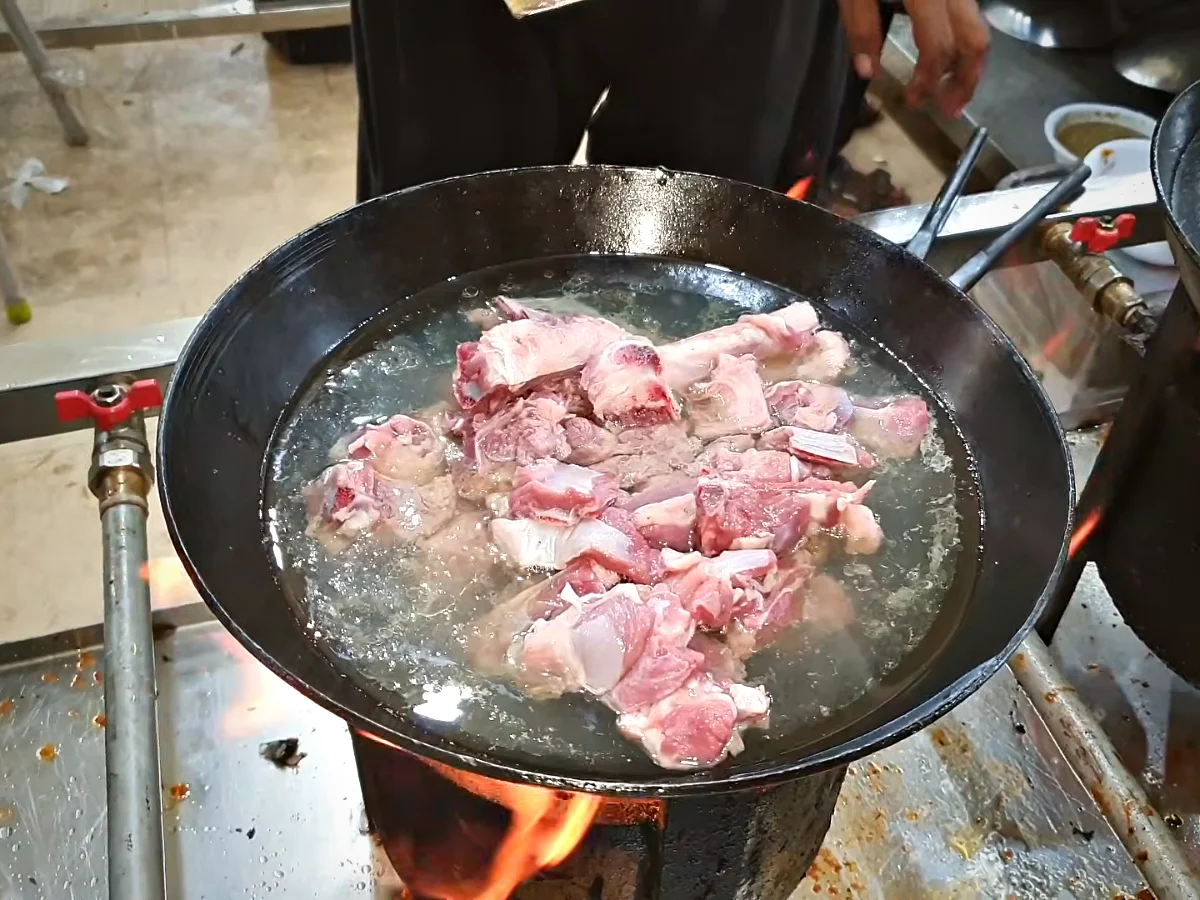 Mutton with oil, water and ginger garlic paste in a karahi