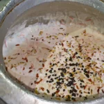 Doodh dulari topped with almonds, pistachios, chocolate chips and colourful vermicelli