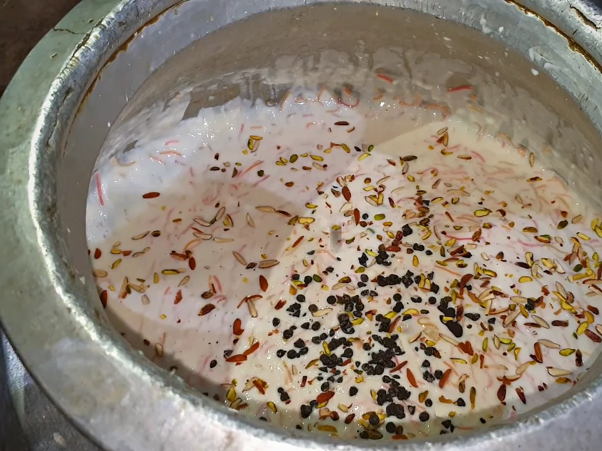 Doodh dulari topped with almonds, pistachios, chocolate chips and colourful vermicelli