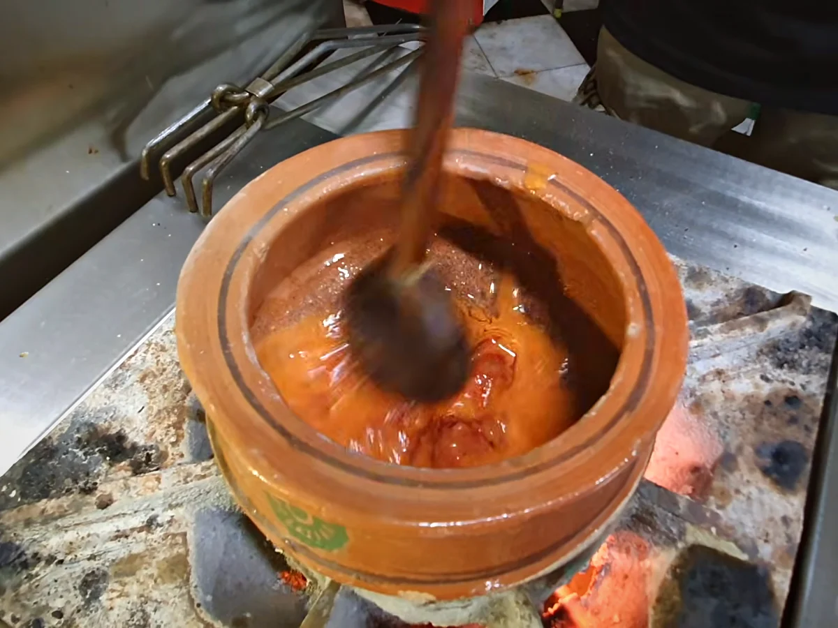 Tomato paste added to the handi for dal makhani