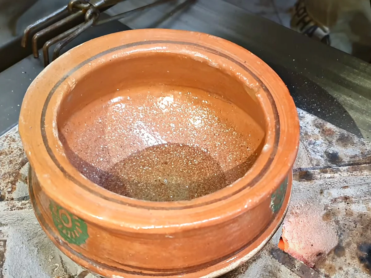 Tomato puree added to hot oil in a handi for dal makhani