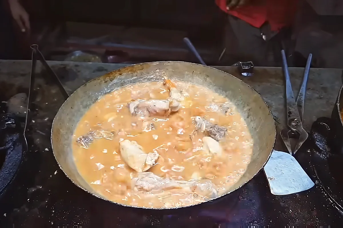 Soft tomatoes mashed into chicken to make karahi gravy