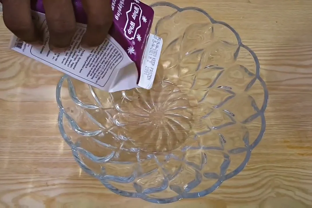 Whipping cream in a bowl for mango ice cream