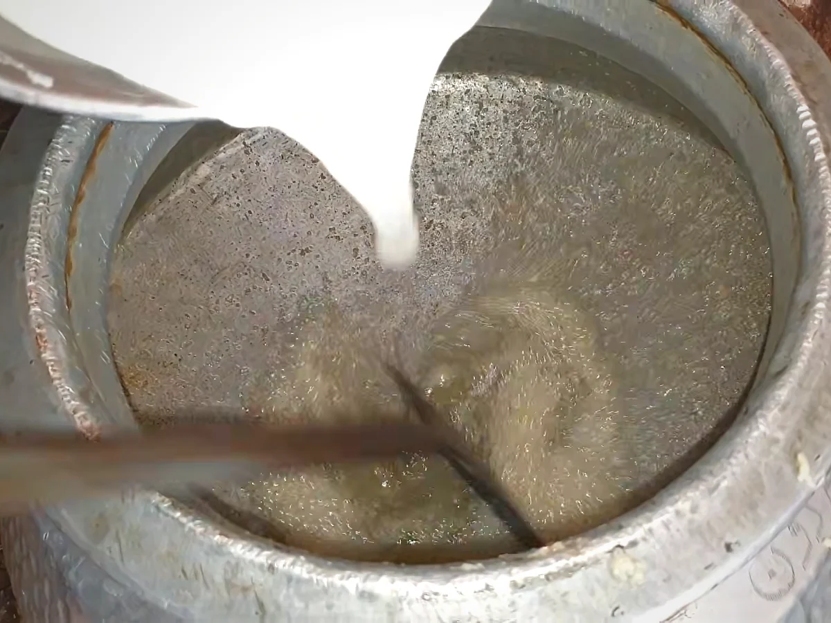 Yogurt poured into oil and ginger garlic paste for haleem korma