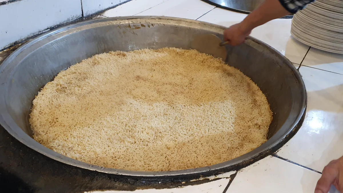Cooked golden pulao rice in the deg after dum