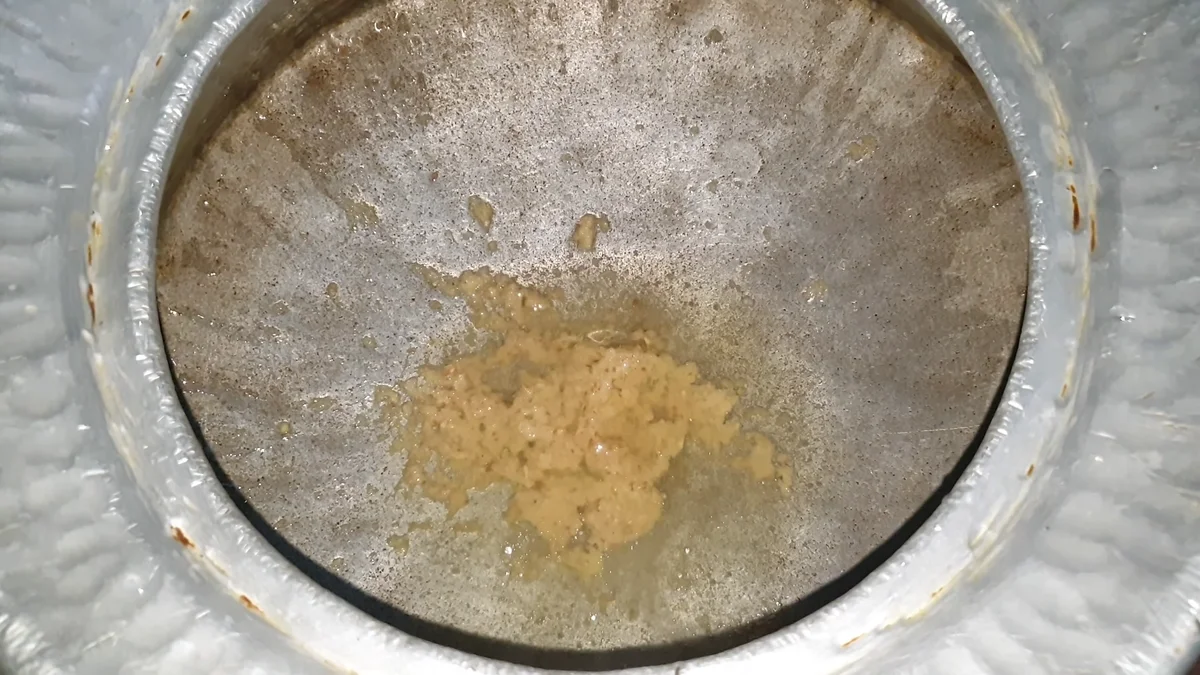 Ginger garlic paste frying in hot oil in the pot