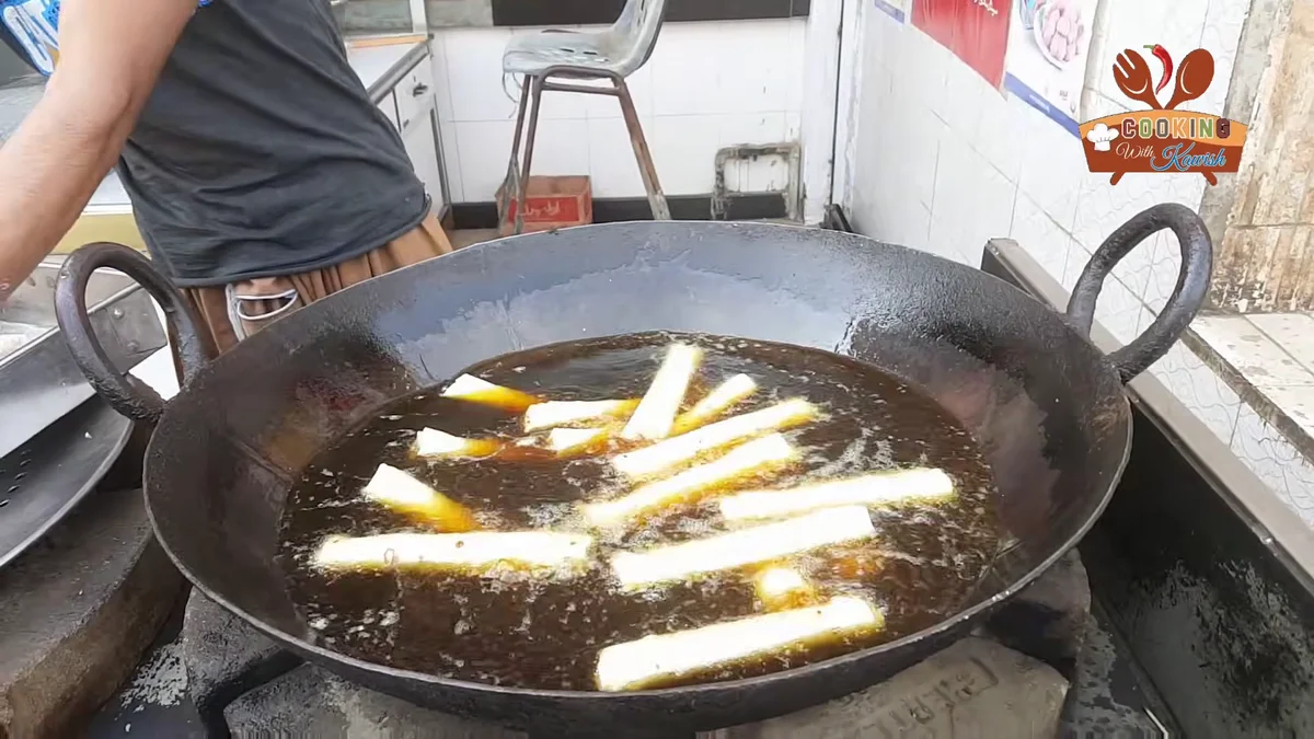 Spring rolls frying in hot oil