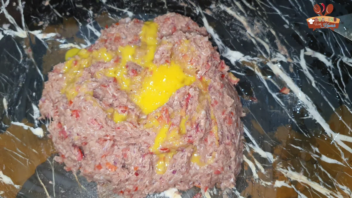 Egg mixed into the chapli kabab mince