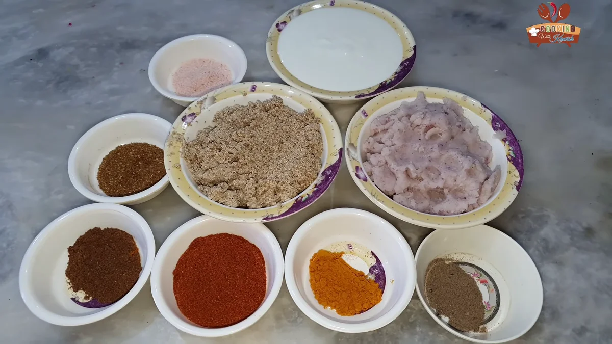 Bowls of ground spices, poppy seeds and onion paste for pasanday