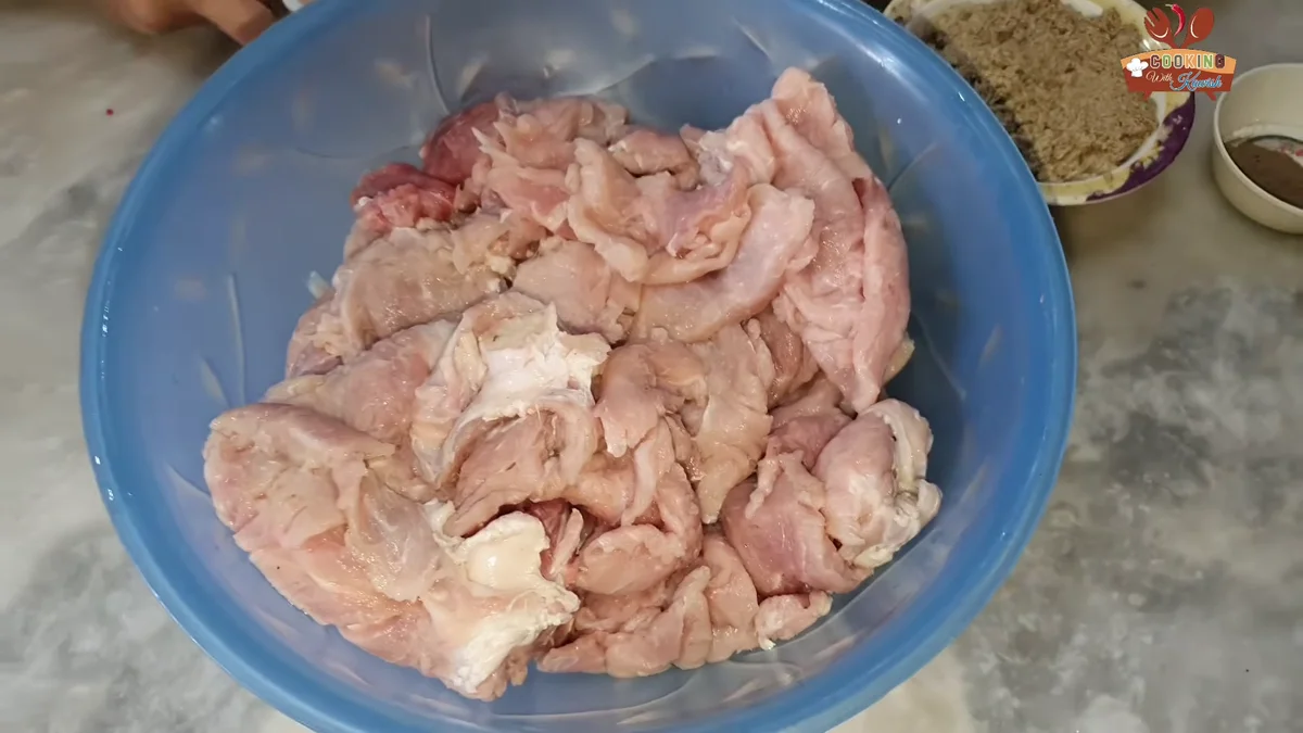 Thin pasanday-cut beef layers in a blue bowl