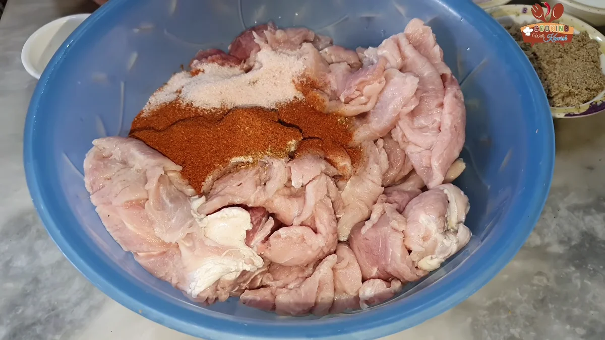 Red chilli powder added over the beef layers