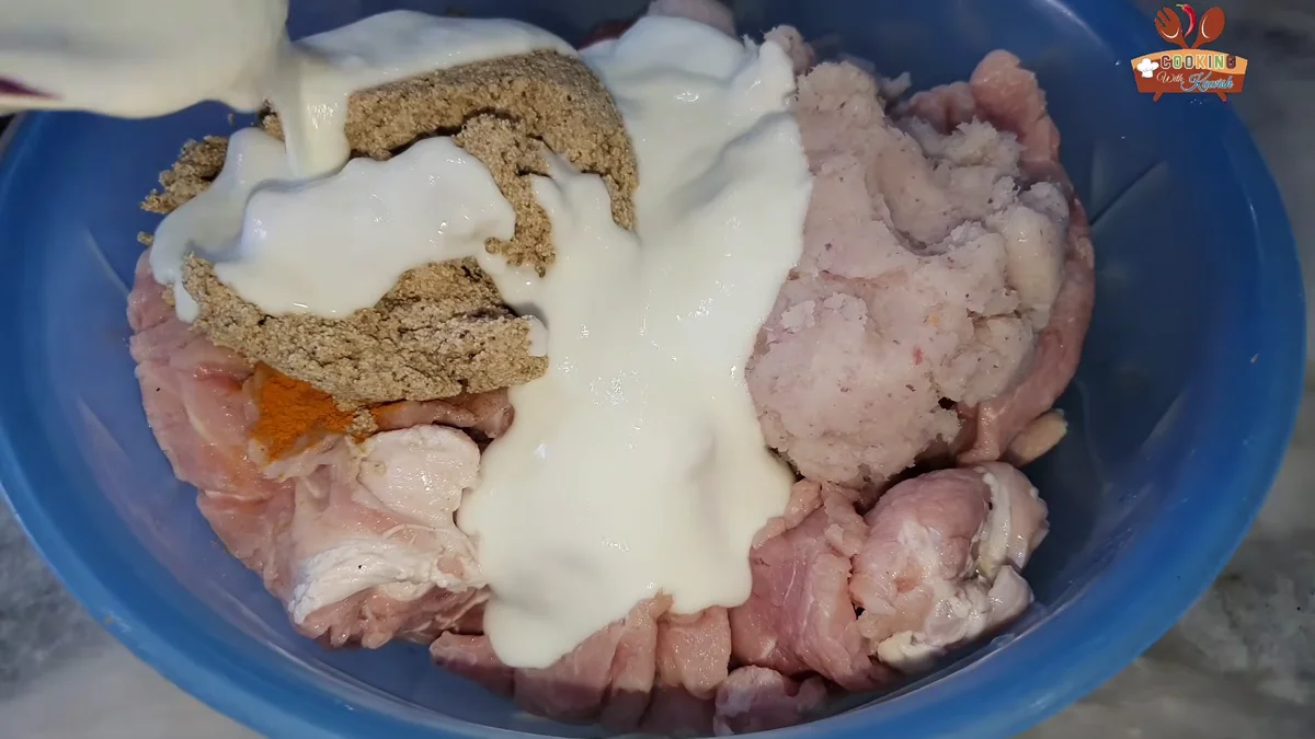 Whisked yogurt poured over the pasanday marinade