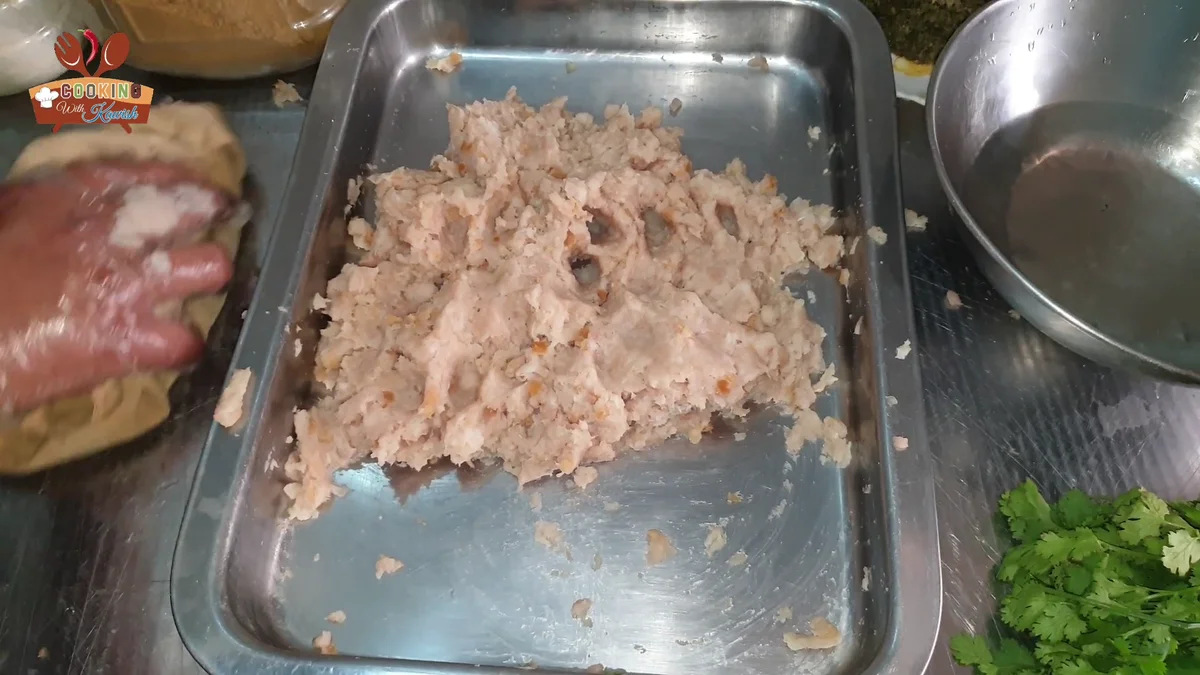 Chicken mince spread in a large steel tray