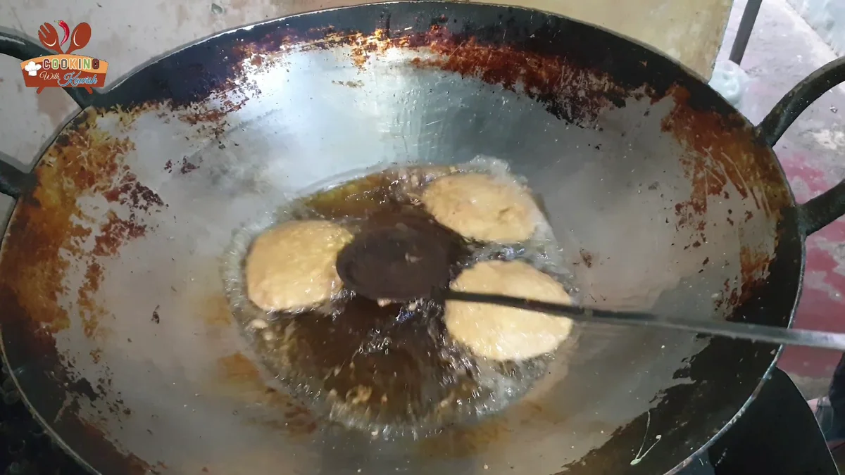 Cutlets frying in oil in a wok