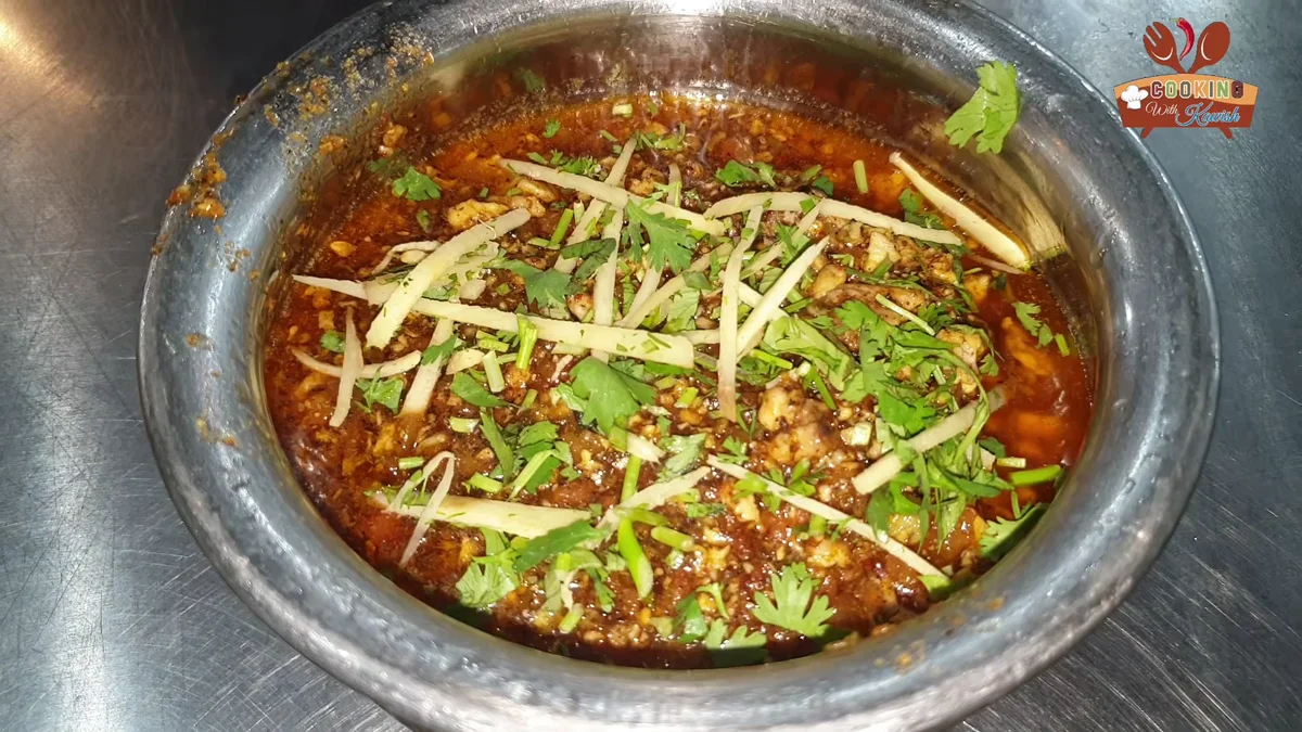 Brain masala in a steel bowl with ginger and coriander