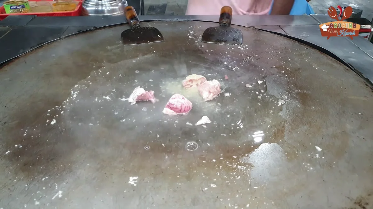 Brain pieces cooking on the tawa