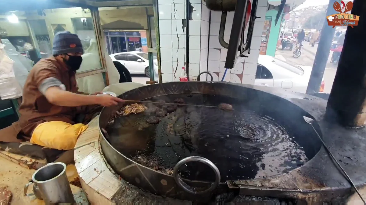 Chapli kababs frying in the big pan