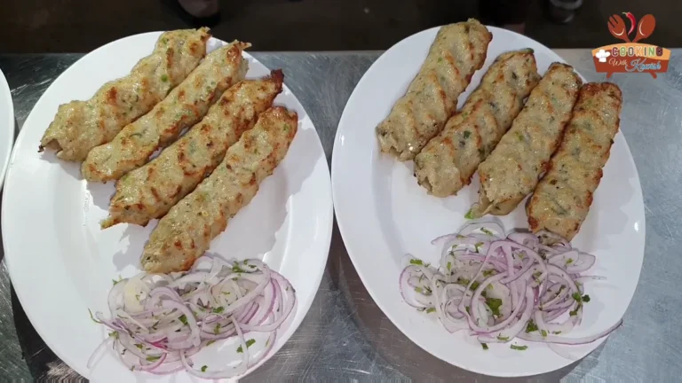 Two plates of Lejana chicken reshmi kababs served with onion rings