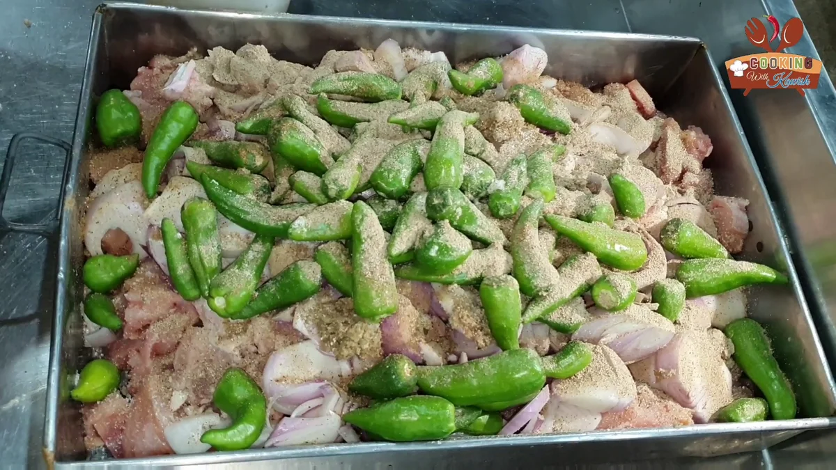 Dry spices sprinkled over the reshmi kabab mixture