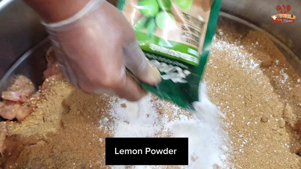 Lemon powder being added to the chicken