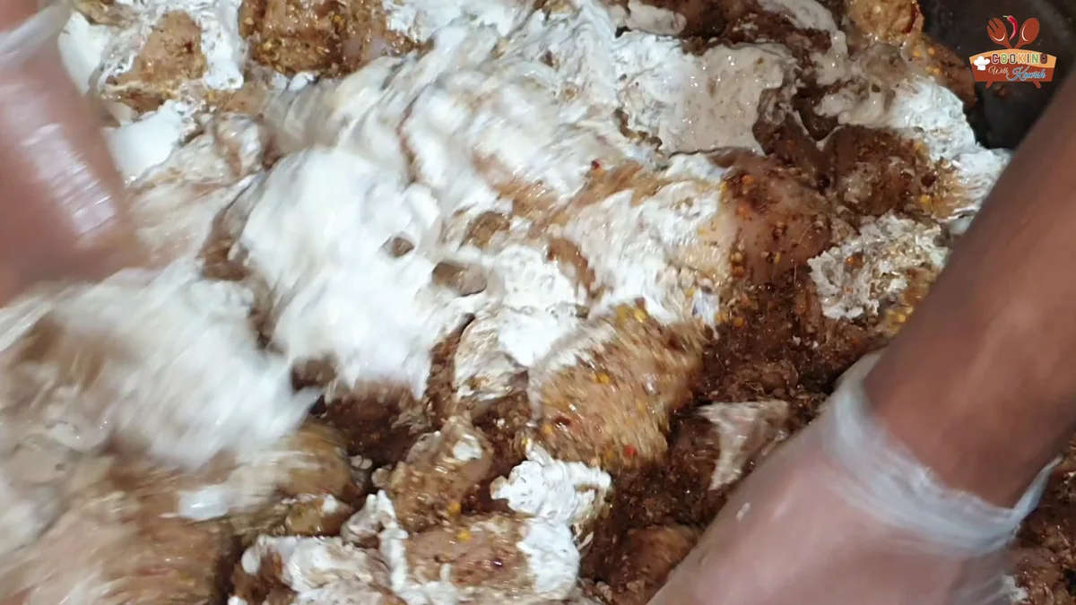 Mixing the cream into the malai boti marinade