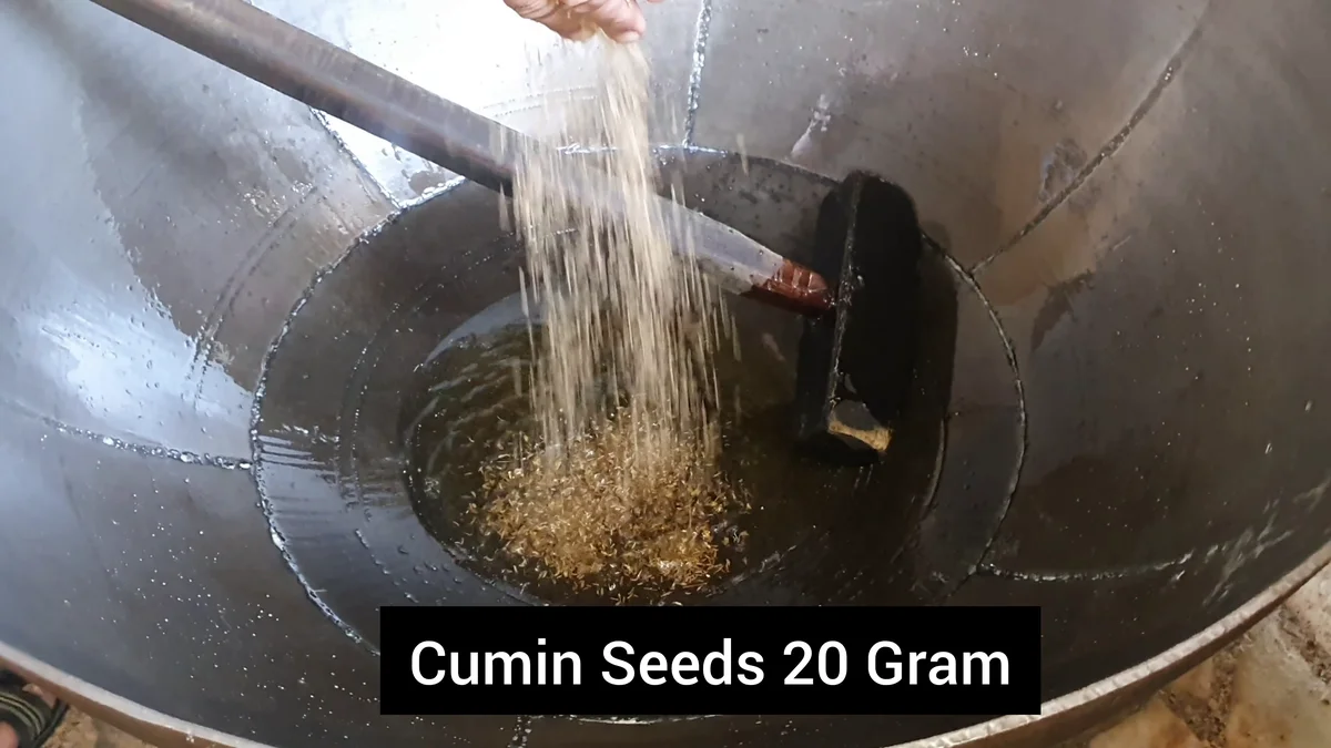 Cumin seeds added to the hot ghee