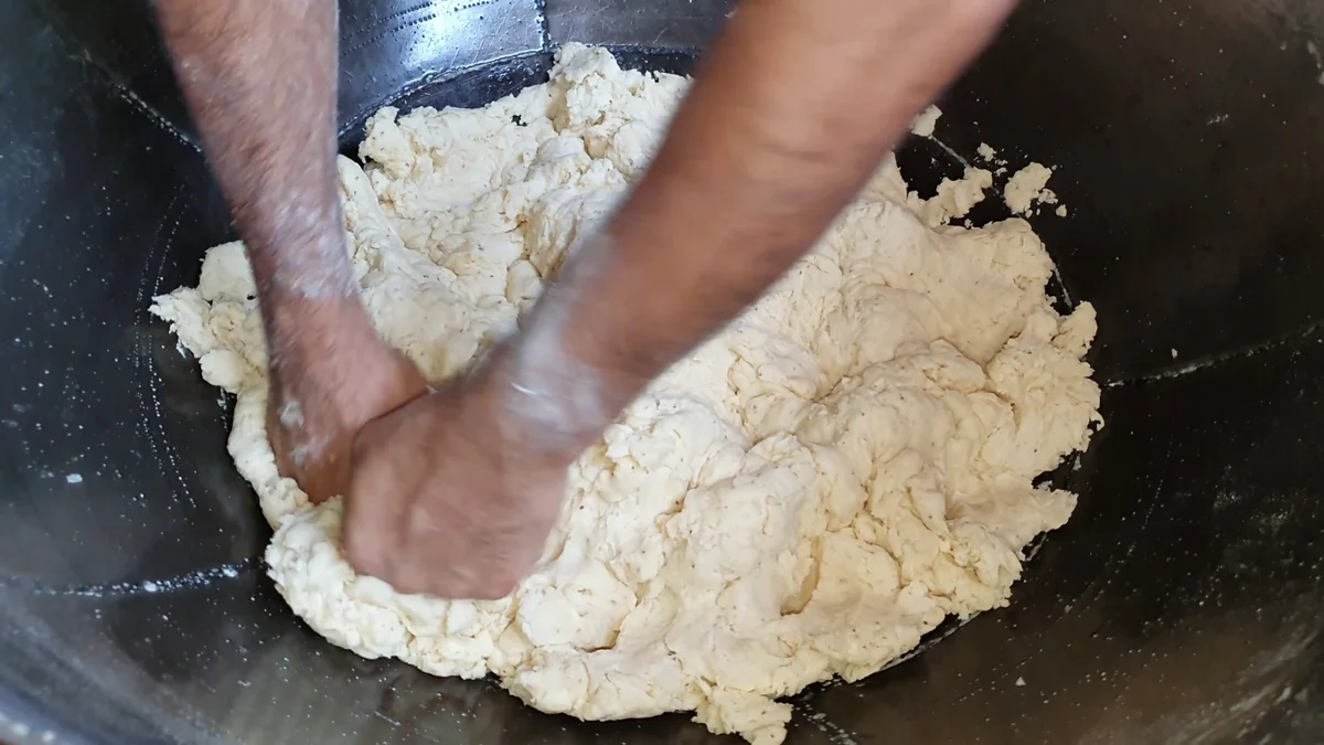 Kneading the stiff samosa dough