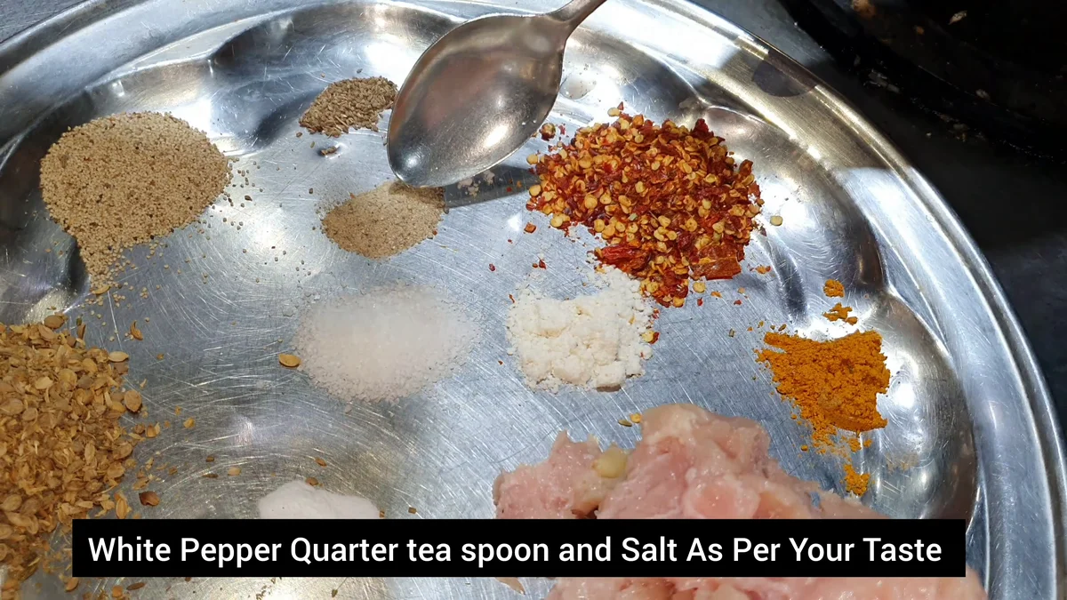 White pepper and salt added to the chicken mince