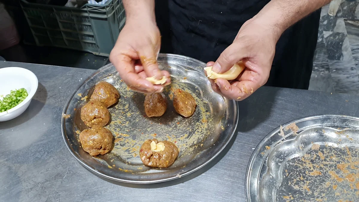 Chicken balls stuffed and ready for coating