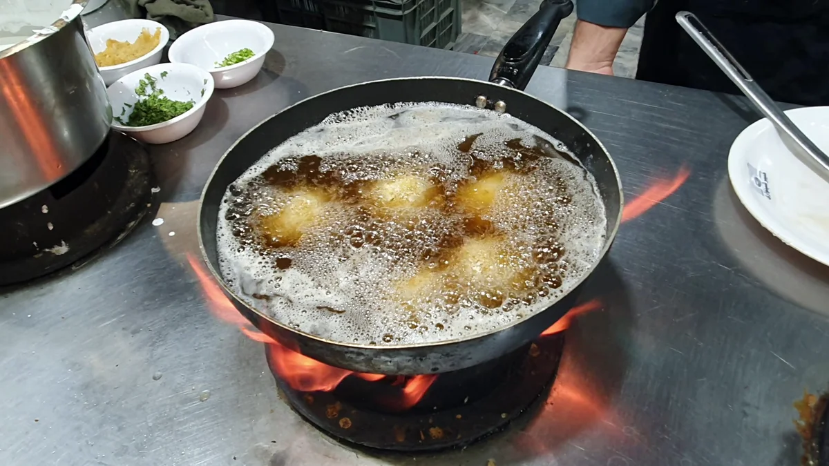 Chicken balls frying in hot oil