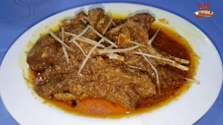 Plate of danedar mutton korma with ginger julienne