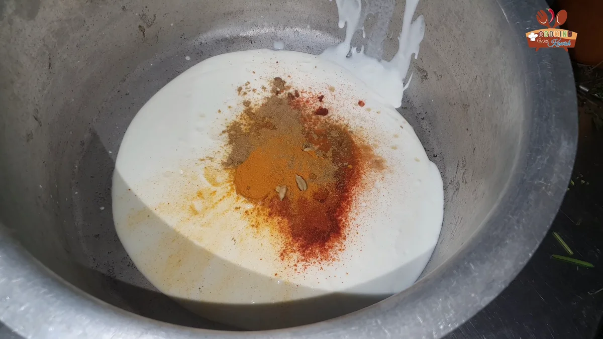 Red chilli powder and spices added to the yogurt