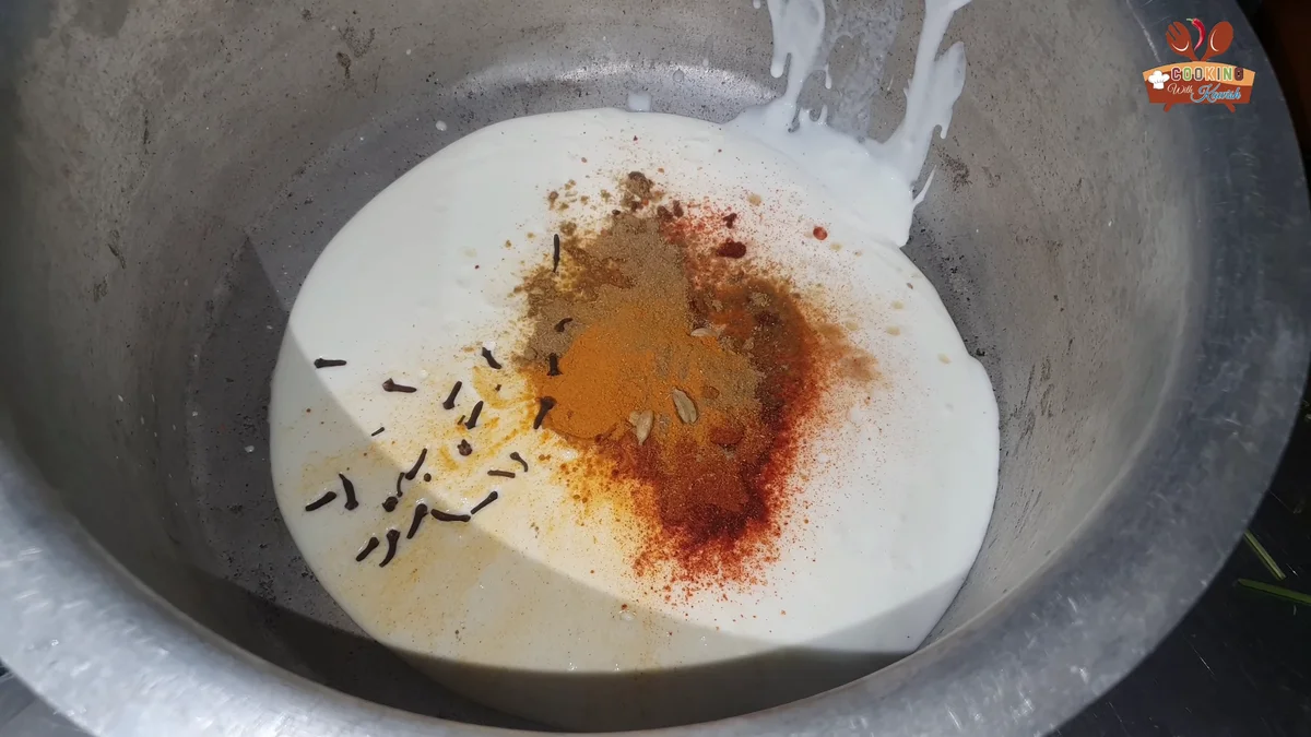 Cloves and whole spices added to the yogurt and spices