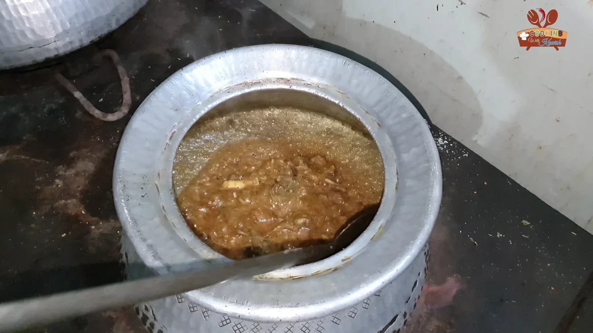 Stirring the korma on high flame to make it danedar